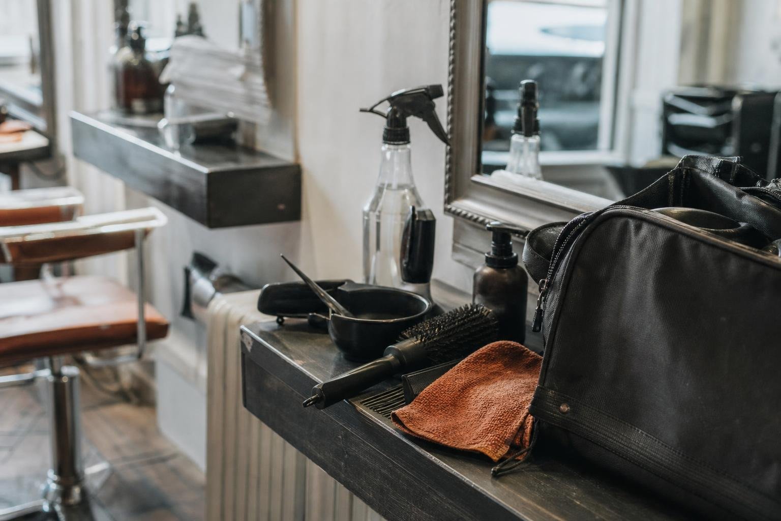 One chair renter's own brushes and kit bag on a station in somebody else's salon, where Google Ads gets complicated